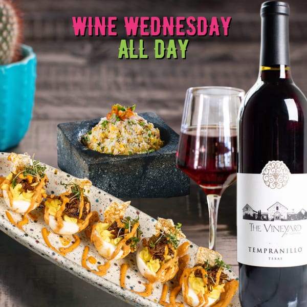 Mexican appetizers and a bottle of red wine with a glass, advertising "Wine Wednesday All Day".